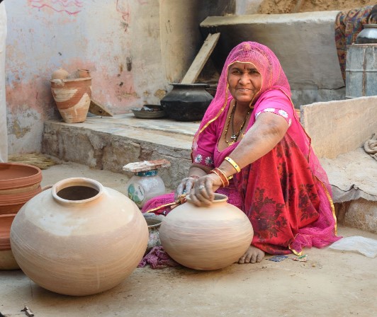 Woman making pottery